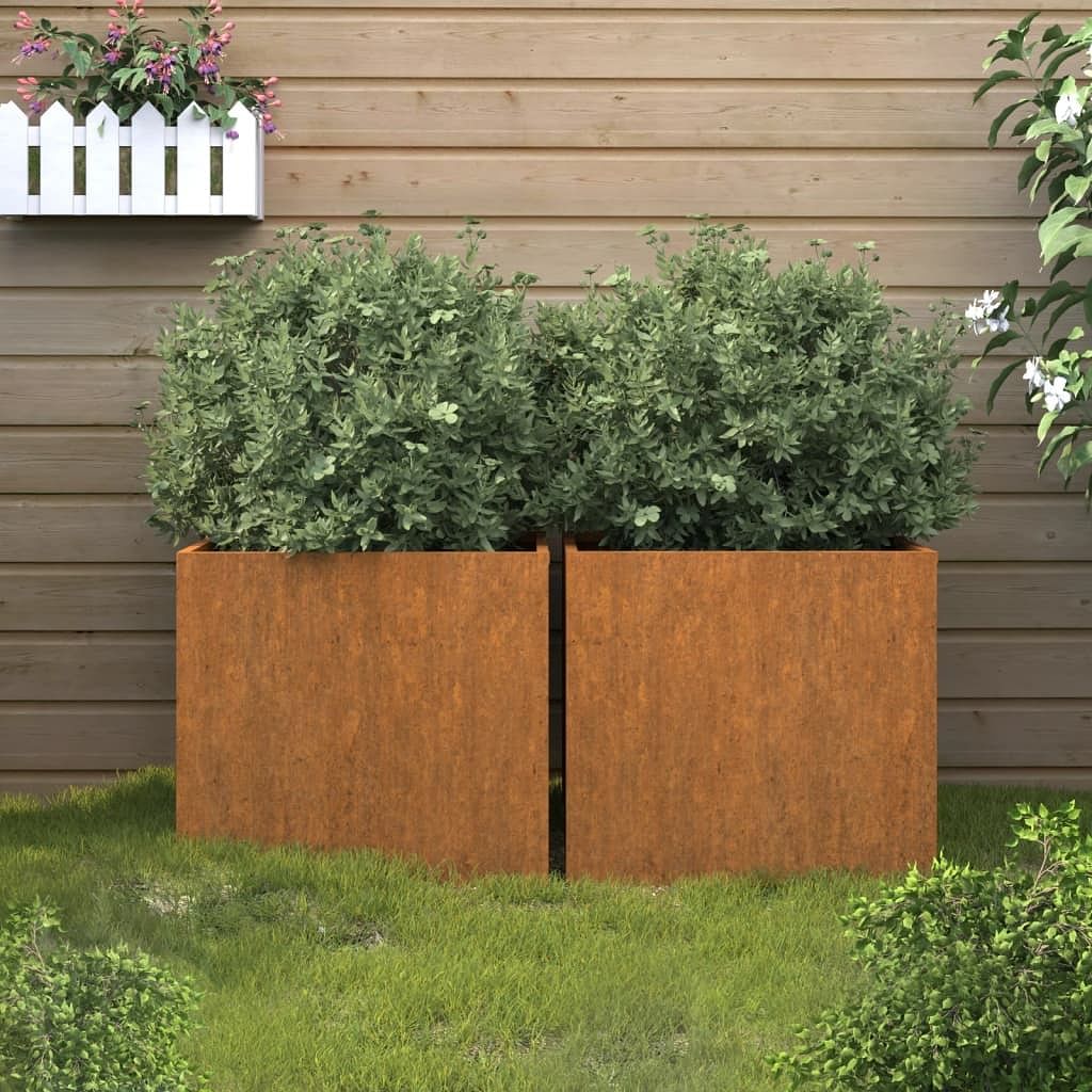 Planter set of 2 starts as natural metal color, turns rusty